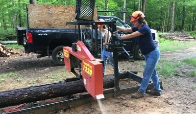 woman working the UConn sawmill in the forest