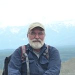 picture of professor with mountain in background